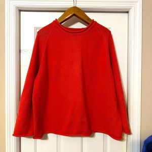 Women’s sweater. Color is coral.  Picture with size best represents color